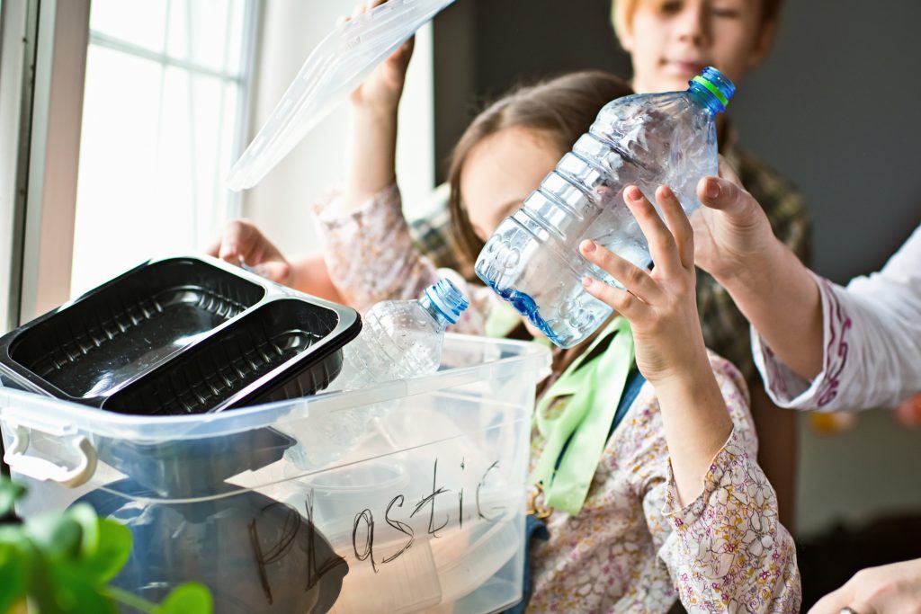 Family sorting out waste for recycling